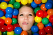 Foto: Woman with lip piercing and coloured balls Woman with lip piercing and coloured balls