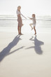 Mother and daughter on sunny beach