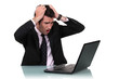 A businessman pissed at his laptop.