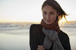 Portrait of serious woman on beach at sunset