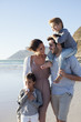 Smiling family on sunny beach