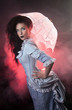 Photo: Beautiful Halloween vampire woman aristocrat with lace-parasol Beautiful Halloween vampire woman aristocrat with lace-parasol