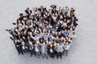 Portrait of waving business people