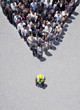 Construction worker at apex of pyramid formed by business people