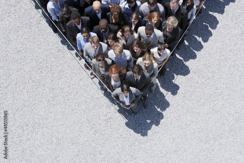 Photo: Rope around business people Rope around business people
