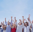 Cheering crowd with arms raised