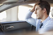 Frustrated businessman driving car
