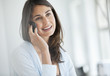 Smiling woman talking on cell phone