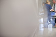 Doctor and nurses wheeling patient in hospital corridor
