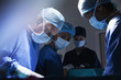 Surgeons concentrating in operating room