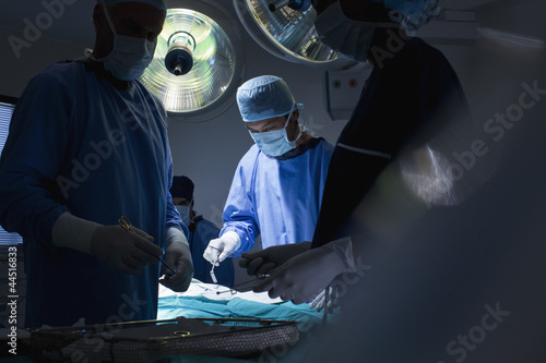 Photo: Surgeons working in operating room Surgeons working in operating room