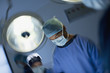 Surgeons working in operating room
