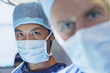 Close up of serious surgeons in surgical masks