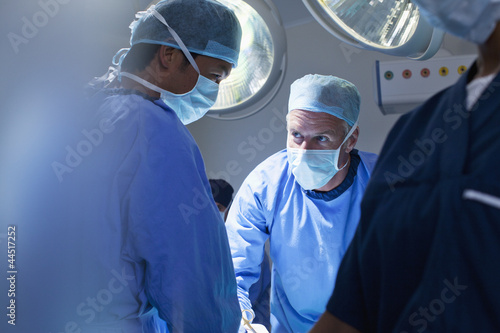 Photo: Surgeons working in operating room Surgeons working in operating room