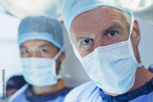 Photo: Close up portrait of serious surgeons Close up portrait of serious surgeons