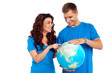 Couple discussing about specific country while points at it