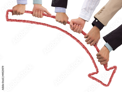 Photo: Hands holding red arrow pointing downwards Hands holding red arrow pointing downwards
