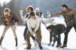 Friends enjoying snowball fight in field