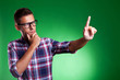 Young casual man pensively selecting something