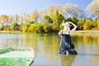 woman fishing in pond