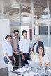 Photo: Portrait of smiling business people in conference room Portrait of smiling business people in conference room