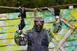 Photo: Paintball players in full gear at the shooting range Paintball players in full gear at the shooting range