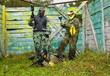 Photo: Paintball players in full gear at the shooting range Paintball players in full gear at the shooting range