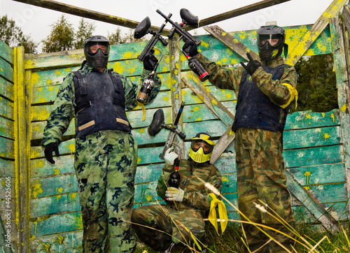 Photo: Paintball players in full gear at the shooting range Paintball players in full gear at the shooting range