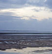 View over estuary and tidal sands in Borth Y Gest, North Wales
