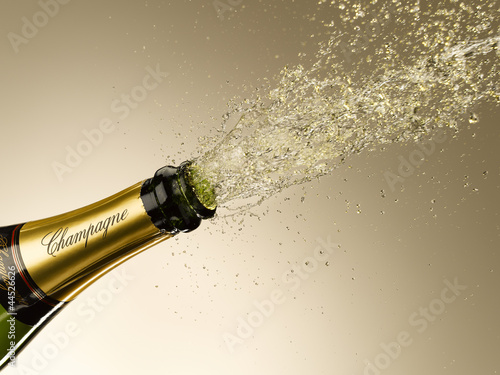 Photo: Champagne exploding from bottle Champagne exploding from bottle