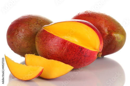 Photo: Ripe appetizing mango isolated on white Ripe appetizing mango isolated on white
