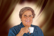 Smiling Grandmother with hot espresso