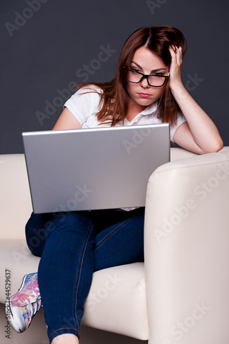 Photo: student looking on laptop student looking on laptop