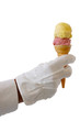 Foto: Gloved waiter handing an ice-cream cone over a white background Gloved waiter handing an ice-cream cone over a white background