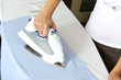bright picture of lovely housewife with iron
