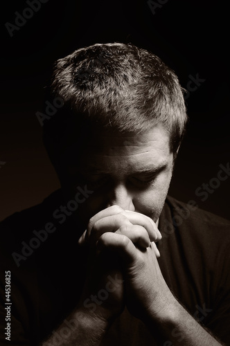 Photo: Praying man. Praying man.