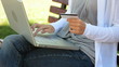 close up of woman holding credit card, typing on the keyboard an