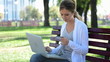 beautiful young woman holding credit card, typing on the keyboar