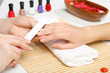 Foto: Woman is getting manicure Woman is getting manicure