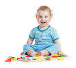 Photo: happy child playing educational toys isolated on white happy child playing educational toys isolated on white