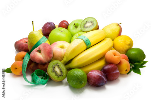 Foto: Different sorts of fruit and spicy herbs isolated on white . Different sorts of fruit and spicy herbs isolated on white .