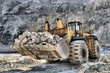Wheel loader machine unloading rocks