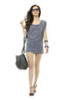 The fashionable young woman in sunglasses with handbag