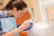 Dental patient woman spit water after treatment