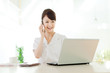 Photo: Beautiful business woman using a laptop computer. Portrait of as Beautiful business woman using a laptop computer. Portrait of as