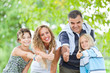 Happy Family Outdoor with Thumbs Up