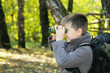 Boy looking through binoculars