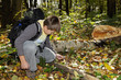 Boy setting fire with magnifying glass