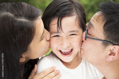 Photo: happy asian family in kissing happy asian family in kissing