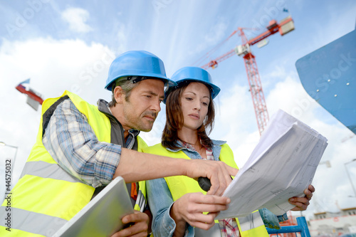 Photo: Construction manager and engineer working on building site Construction manager and engineer working on building site